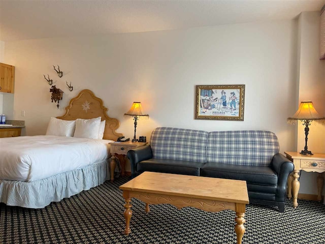 bedroom featuring dark carpet