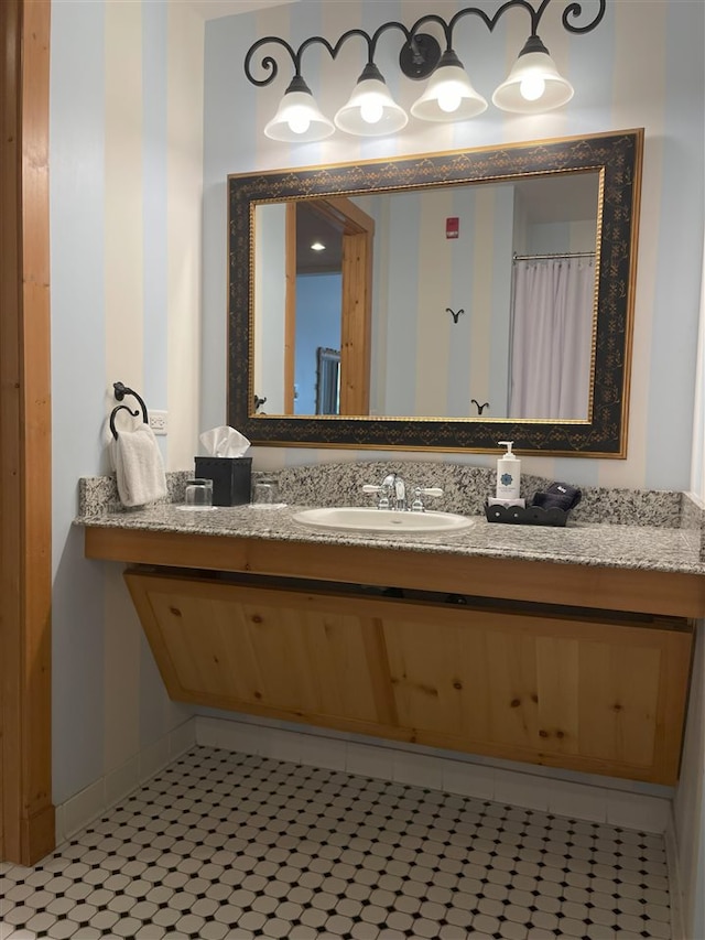 bathroom featuring vanity and tile floors