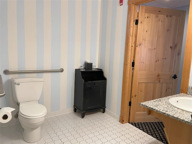 bathroom featuring tile flooring and vanity