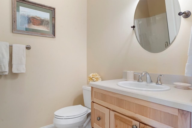 bathroom with toilet and large vanity