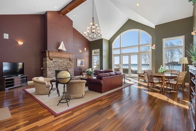 living room with beam ceiling, a fireplace, high vaulted ceiling, a chandelier, and dark hardwood / wood-style floors