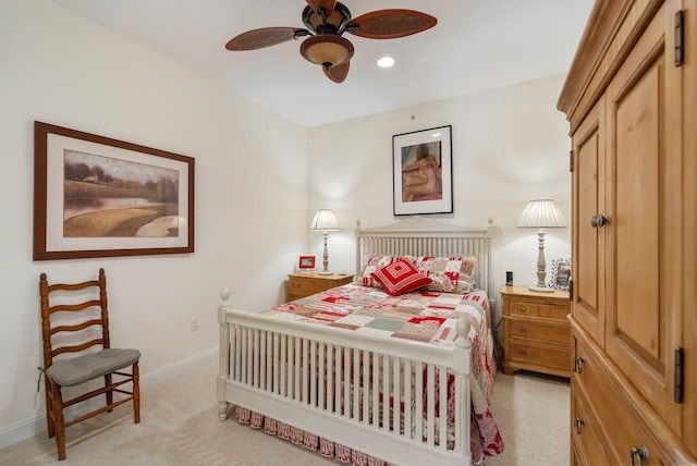 bedroom with ceiling fan and light colored carpet