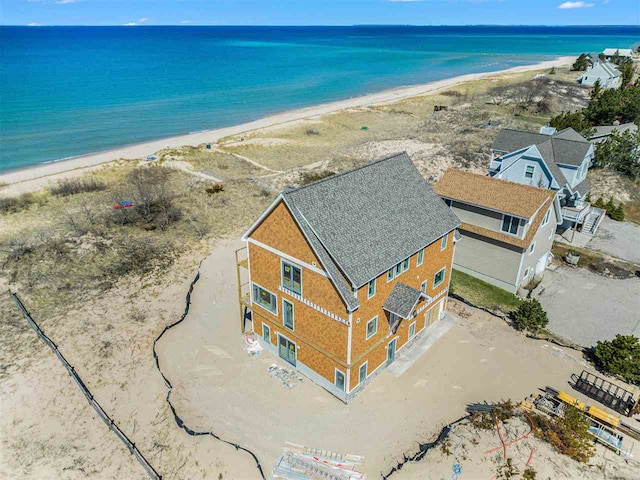 aerial view featuring a water view and a view of the beach