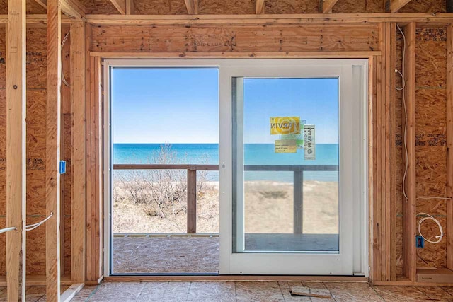 entryway featuring a wealth of natural light and a water view