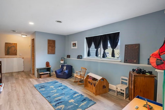 playroom with wood-type flooring