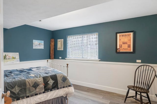 bedroom with hardwood / wood-style floors