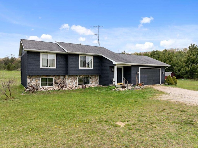 view of front of home featuring a garage and a front lawn