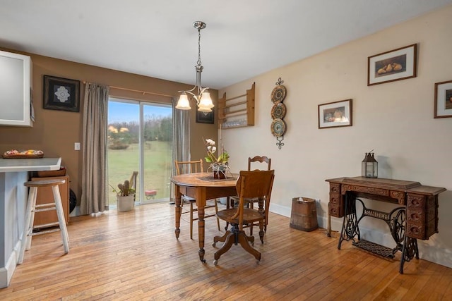 dining space with light hardwood / wood-style flooring