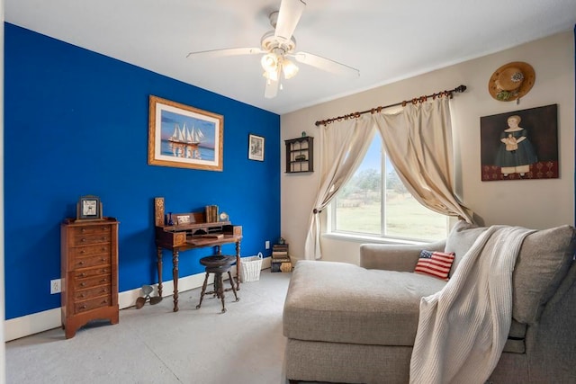 living area featuring ceiling fan