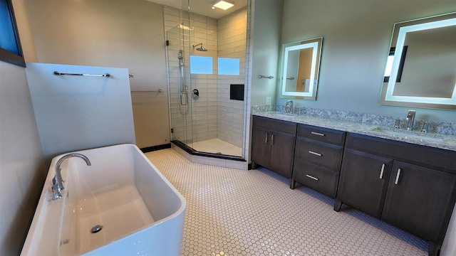 bathroom featuring tile patterned floors, separate shower and tub, and double sink vanity