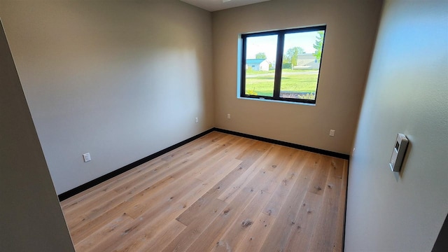 empty room with light wood-type flooring