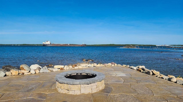 water view featuring an outdoor fire pit