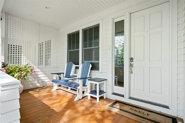 view of exterior entry with covered porch