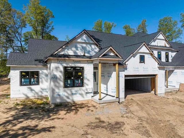 unfinished property with a garage