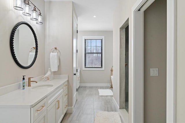 bathroom featuring a bath and vanity