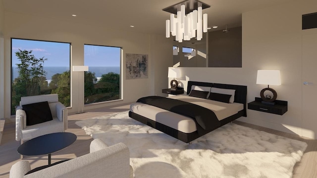 bedroom featuring a notable chandelier and a water view