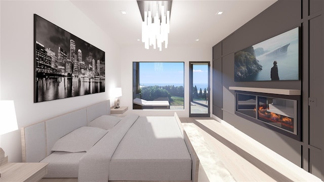 bedroom with a notable chandelier and light wood-type flooring