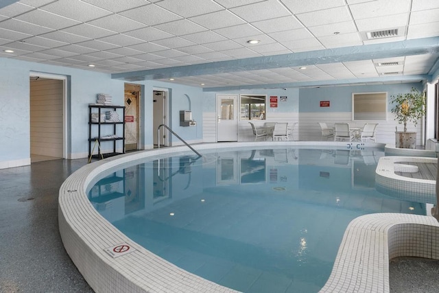 view of pool with a hot tub