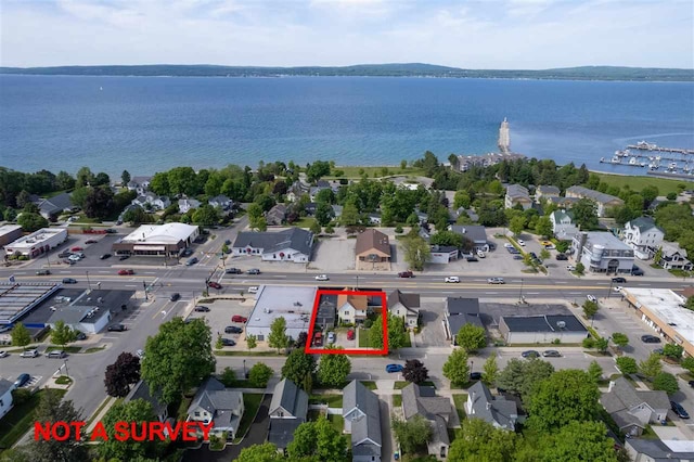 bird's eye view with a water view and a residential view