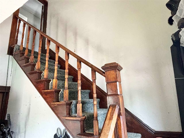 staircase with a high ceiling