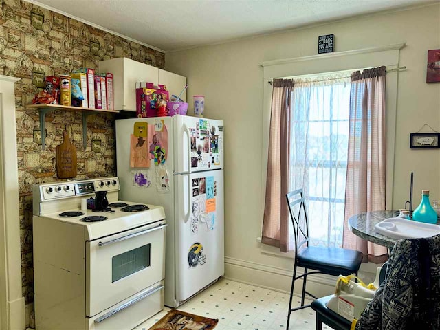 kitchen featuring white appliances and light tile floors