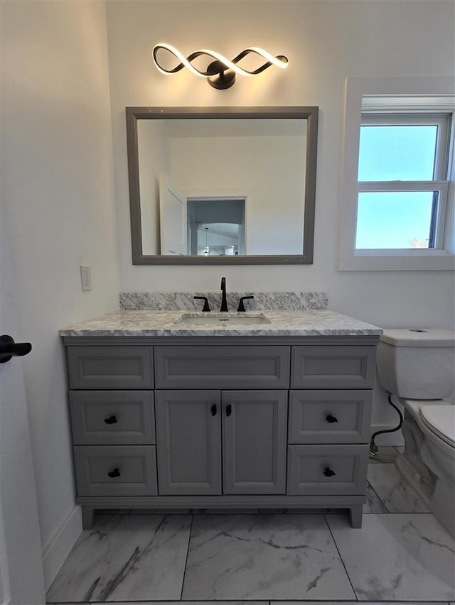 bathroom with vanity and toilet