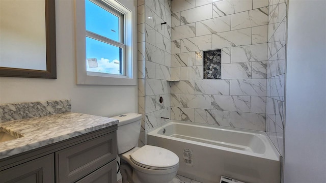 full bathroom with vanity, toilet, and tiled shower / bath