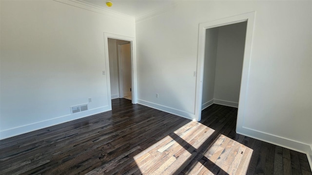 unfurnished room with crown molding and dark hardwood / wood-style floors