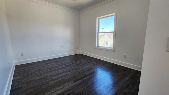 unfurnished room featuring crown molding and dark wood-type flooring