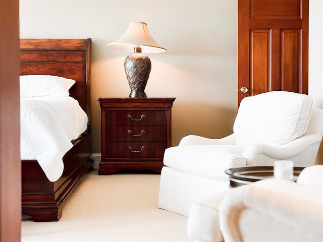 bedroom featuring light colored carpet