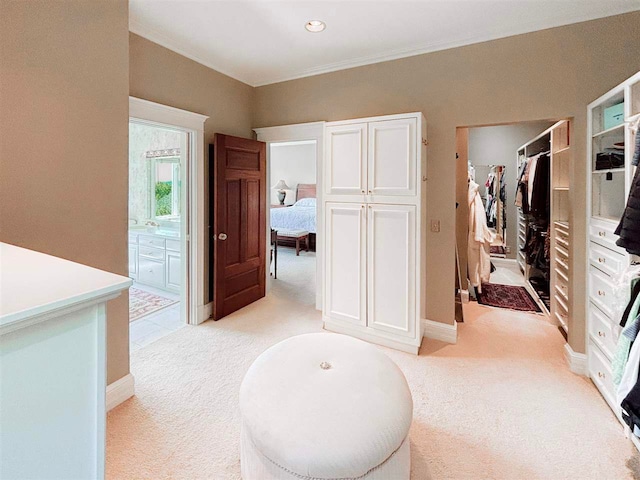 interior space featuring crown molding, baseboards, and recessed lighting