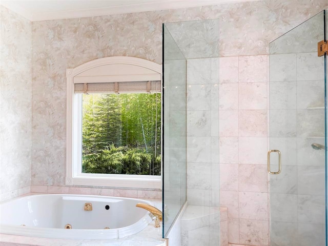 bathroom with shower with separate bathtub and ornamental molding