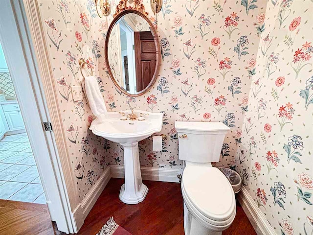 bathroom with tile floors and toilet