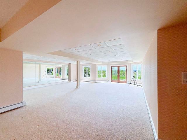 unfurnished room featuring carpet floors and a drop ceiling