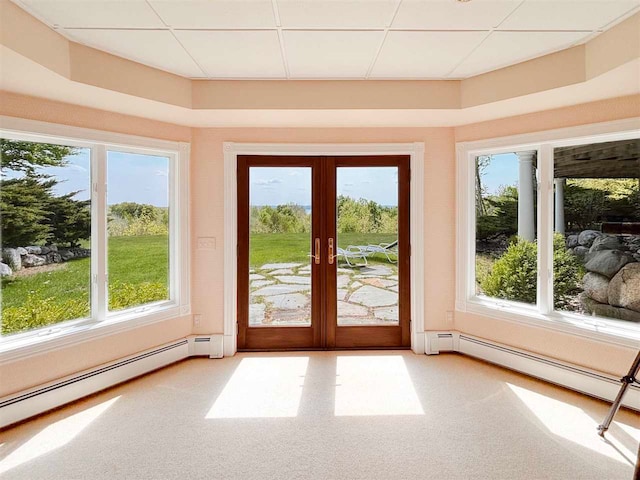 doorway featuring a baseboard heating unit, french doors, and a drop ceiling