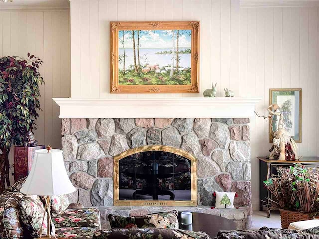 interior details with a stone fireplace and carpet