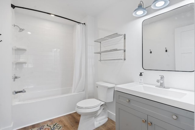 401 Antrim St, Charlevoix, MI 49720 - bathroom with wood finished floors, toilet, shower / tub combo, and vanity
