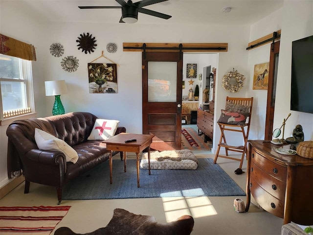 401 Antrim St, Charlevoix, MI 49720 - living room with a barn door and a ceiling fan