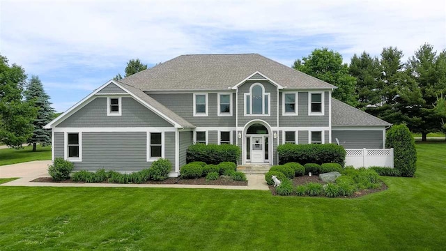 colonial home with a front lawn