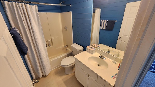 full bathroom with vanity, toilet, shower / tub combo, and wood walls