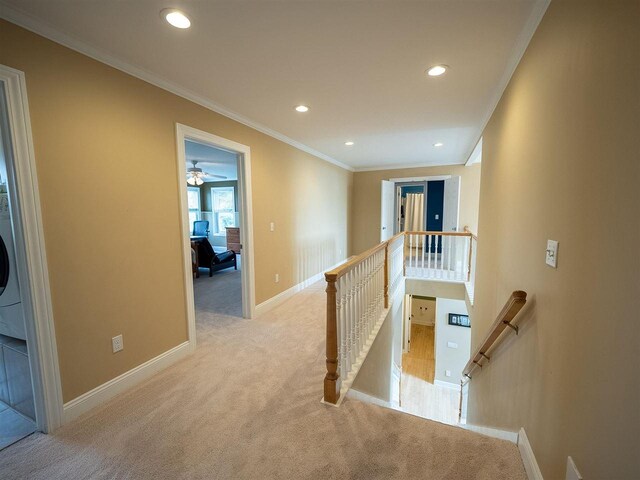 corridor with light carpet and ornamental molding