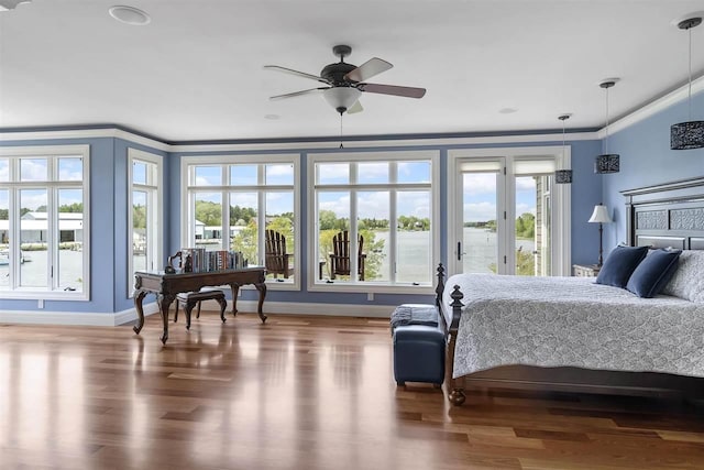 1439 Lindburgh Ln, Cheboygan, MI 49721 - bedroom featuring wood finished floors, access to outside, and crown molding