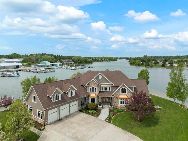 birds eye view of property with a water view