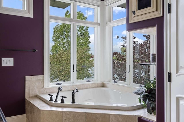 1439 Lindburgh Ln, Cheboygan, MI 49721 - bathroom featuring a bath and healthy amount of natural light