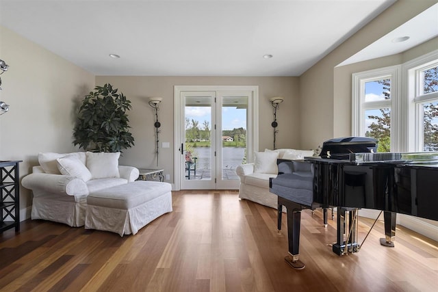 1439 Lindburgh Ln, Cheboygan, MI 49721 - living room featuring wood finished floors and a water view