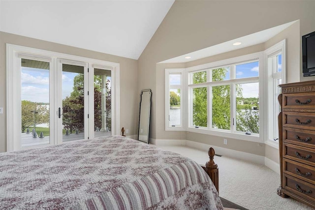 1439 Lindburgh Ln, Cheboygan, MI 49721 - carpeted bedroom with access to outside, multiple windows, vaulted ceiling, and recessed lighting