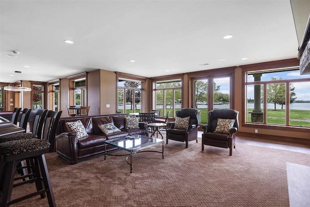 1439 Lindburgh Ln, Cheboygan, MI 49721 - living room featuring carpet floors, healthy amount of natural light, recessed lighting, and a water view