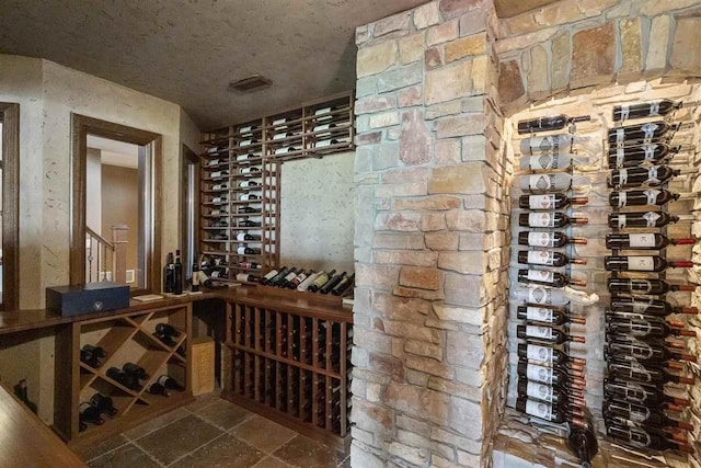 1439 Lindburgh Ln, Cheboygan, MI 49721 - wine area with stone finish flooring