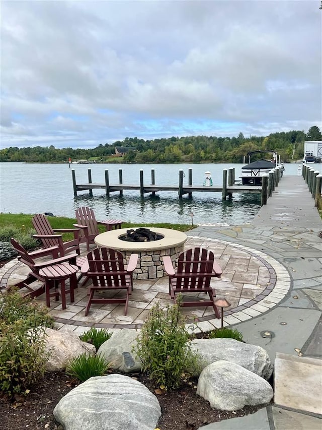 1439 Lindburgh Ln, Cheboygan, MI 49721 - dock area featuring an outdoor fire pit and a water view