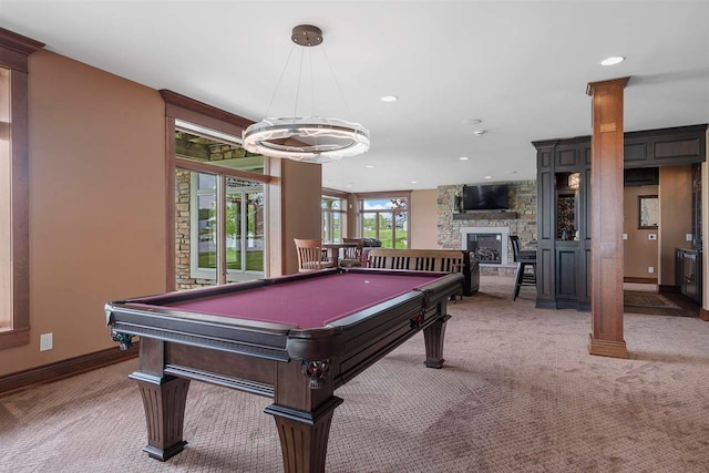 rec room with a stone fireplace, carpet flooring, decorative columns, and pool table